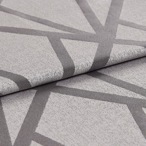 Folded fabric that has a light grey base grey and dark grey geometric lines 