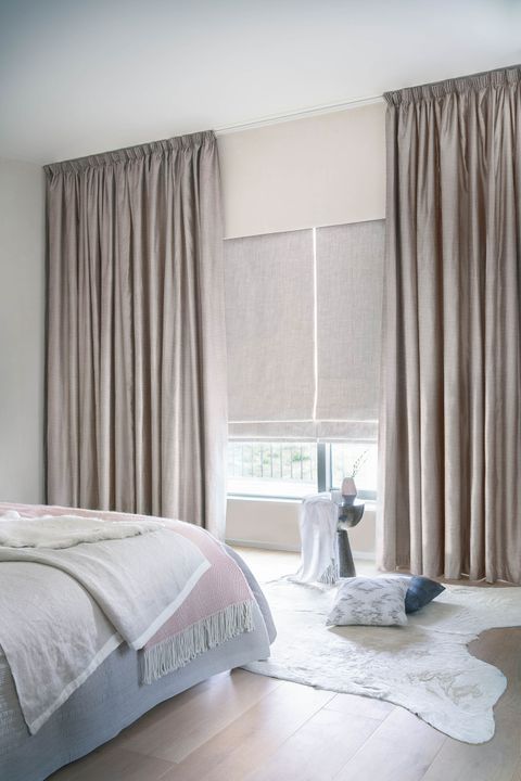Arlington shingle curtains and allure bamboo Roman blinds in a bedroom
