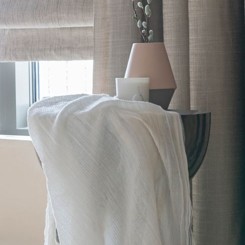 Arlington shingle curtains and allure bamboo romans in bedroom in a close up