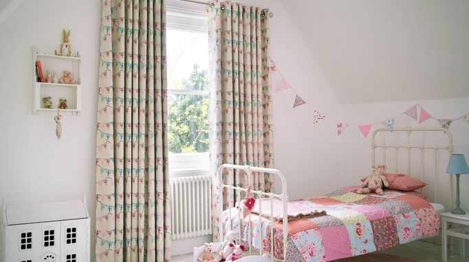 Bunting chintz curtains in child's bedroom