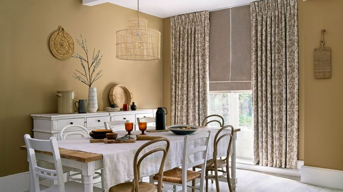 Delizia Taupe curtains and Lindora Linen romans in the dining room