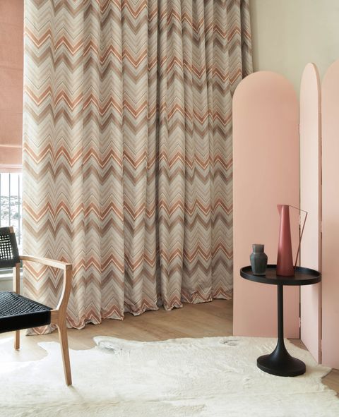 Art deco styled bedroom with chevron print curtains 