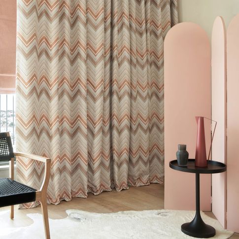 Art deco styled bedroom with chevron print curtains 