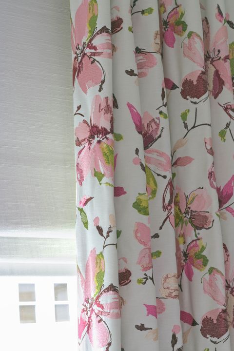 Close up of a Forenza Rose curtain Islita Ice over a White Romans in bedroom