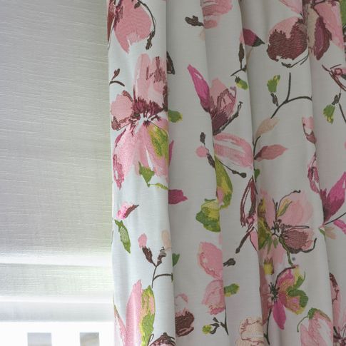 Close up of a Forenza Rose curtain Islita Ice over a White Romans in bedroom