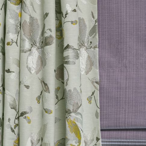 Close up of Forenza Sterling curtains Clarence Mauve Roman blind in living room