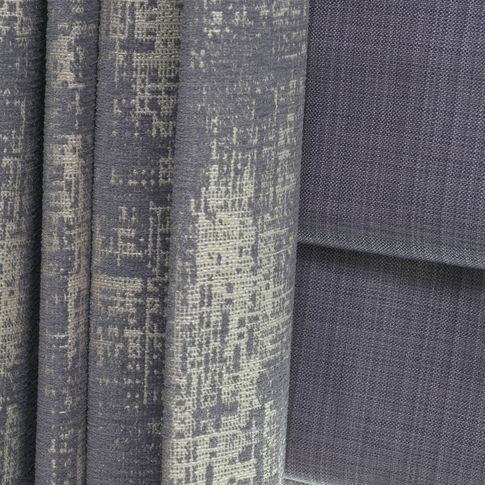 Close up of  Infinity Lilac Grey curtains and Clarence Mauve romans in the living room