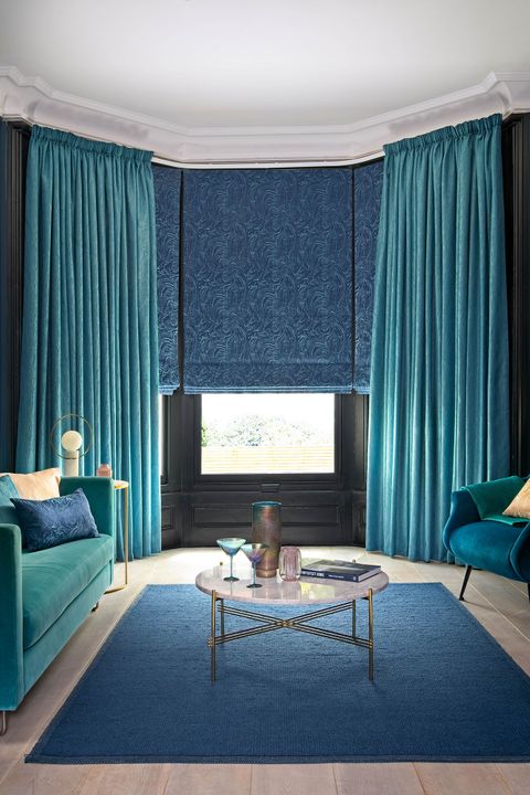 Close up of Surface Peacock curtains and Muse Deep Lapis romans in living room