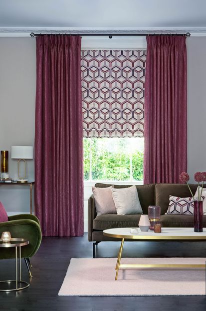 Surface Port curtains and  Metro Maroon romans and cushions on sofa in the living room  
