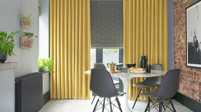  Mustard curtains and grey printed roman blinds in dining room