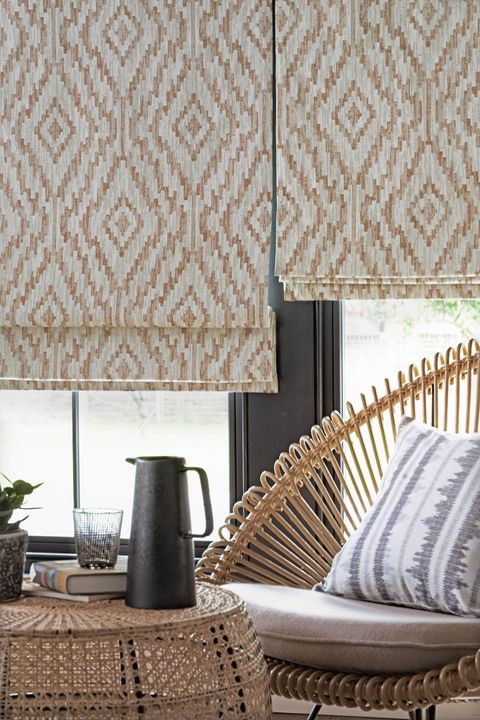 Cream brown patterned roman blinds in garden room 
