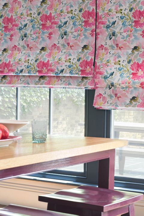 Close up of pink floral Roman blinds in the dining room