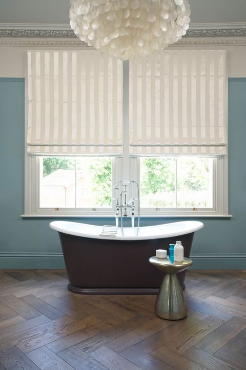 Pearl and cream stripy Roman blinds in a bathroom