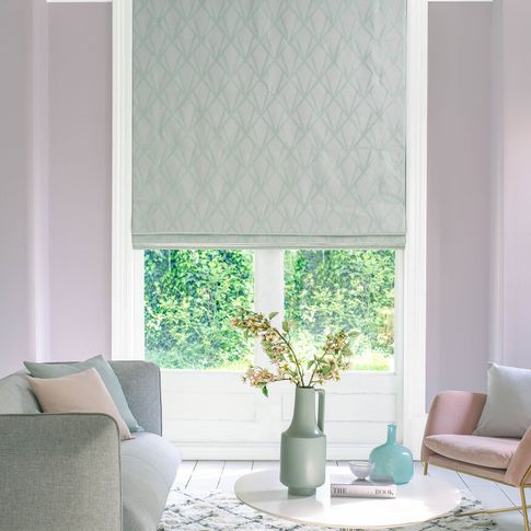 Grey patterned roman blinds in living room