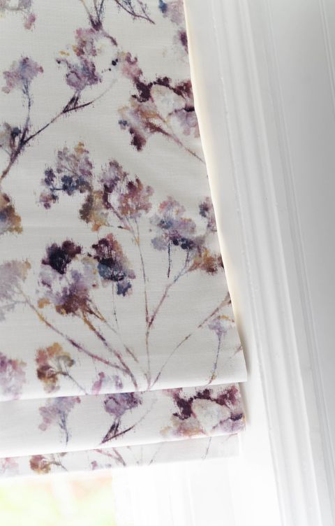 Close up of white floral printed Roman blinds