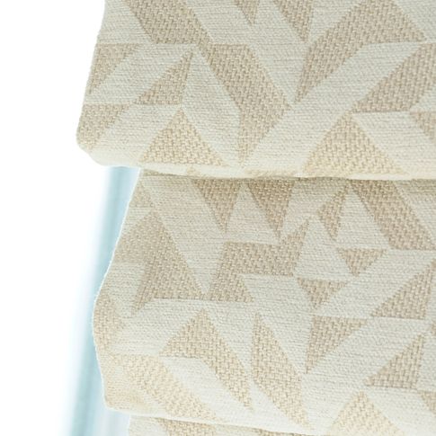 Close up of cream geometric printed Roman blinds
