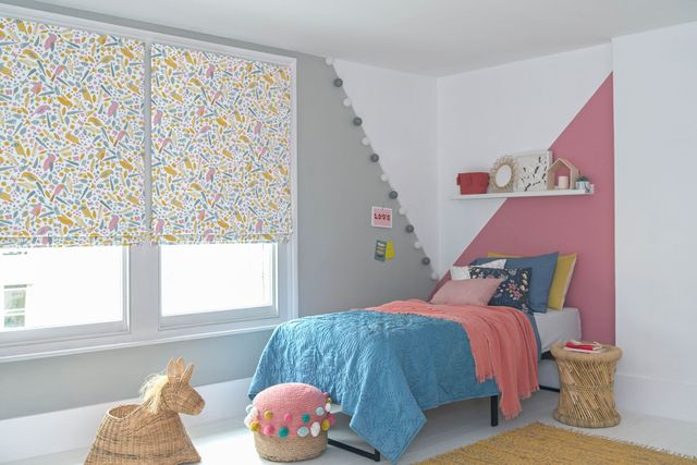 Kids bedroom windows dressed with roman blinds featuring toucan print on whitebackground