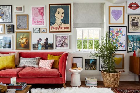 A vibrant gallery wall with a small sash window