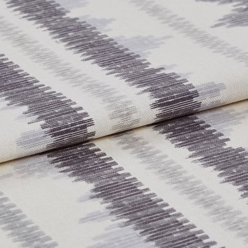 White base colour fabric with black and grey zig zags in repeating pattern across the material