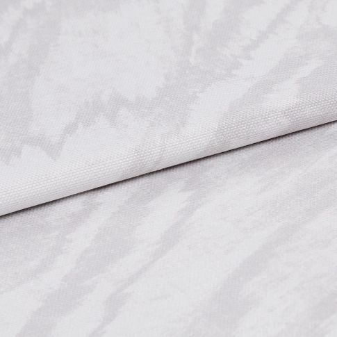 White coloured fabric with a swirling pattern in grey that repeats to create the look of alabaster