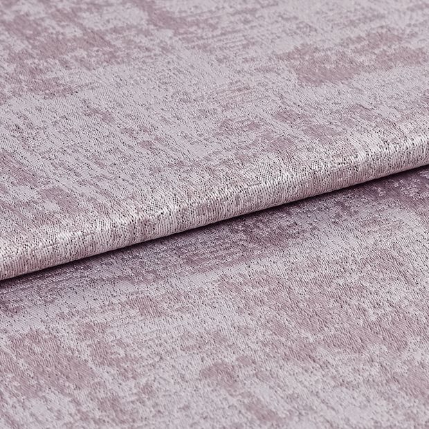 Folded fabric in a shimmering and textured purple colour 