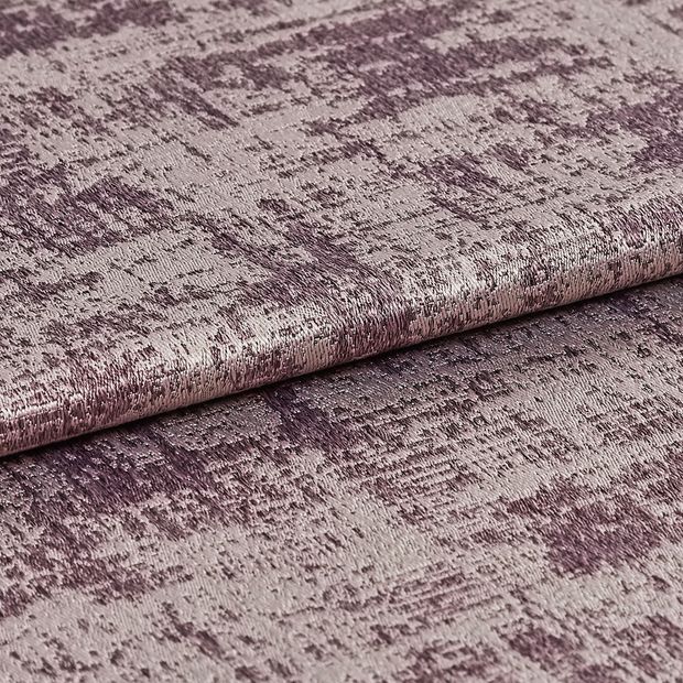 Folded material that is decorated with a shining silver colour and textured purple 