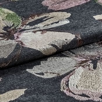 The Forenza Midnight fabric folded, showing a floral design on a black background