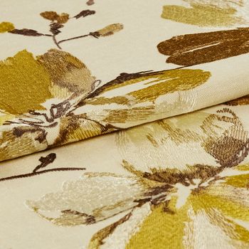 A folded view of the Forenza Sunrise fabric, highlighting its golden floral design