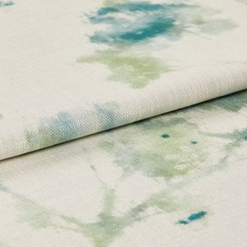 White fabric with floral patterns in a watercolour style 