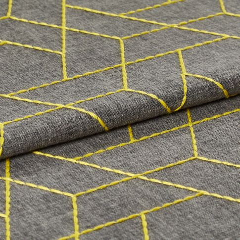 Yellow lined geometric shaped in a repeating triangular pattern are woven into this swatch on the grey base colour of the fabric