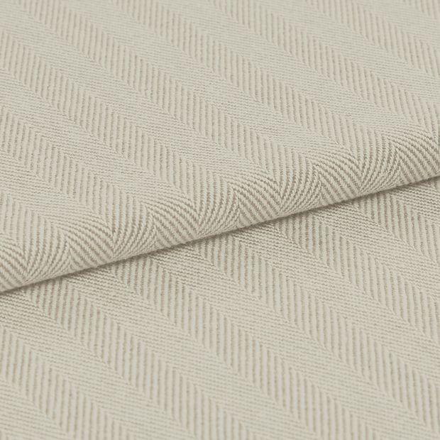 A striped, neutral folded fabric, in the Kendra Linen design