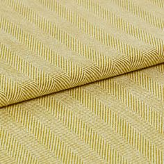 A folded view of the Kendra Maize fabric, showing its striped yellow design