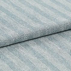 A folded view of the Kendra Navy fabric, which is in a striped blue design