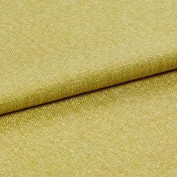 The yellow Lindora Husk fabric with a fold