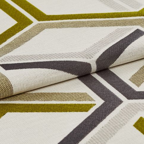 Cream coloured fabric with a repeating geometric pattern in yellow, grey and neutral tones