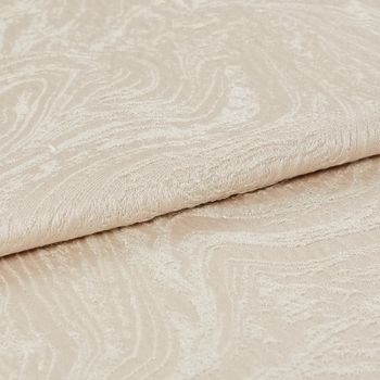 Cream and white coloured fabric in a repeating swirling pattern