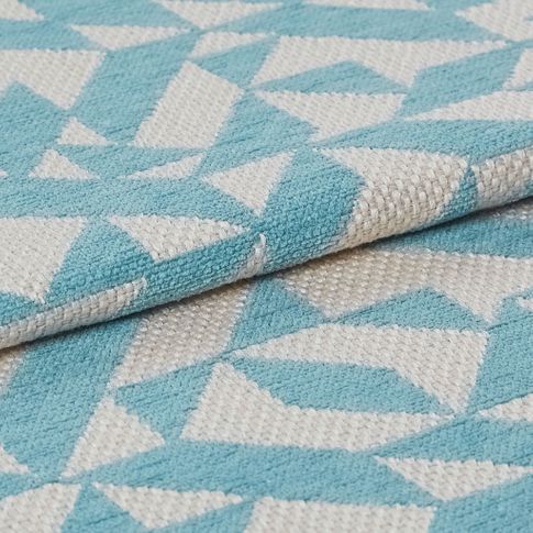 Swatch of folded terrazzo teal fabric