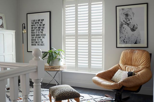 white full height shutters in a stylish landing window 