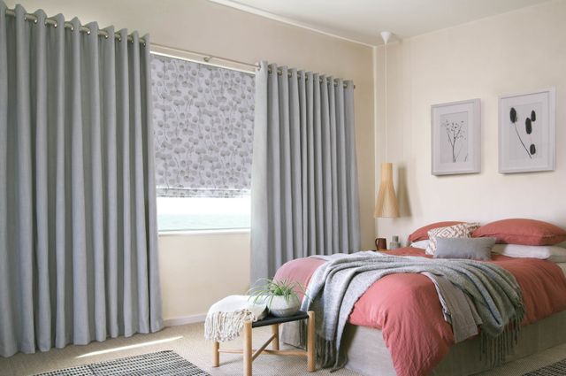 pale blue blackout curtains in a bedroom window