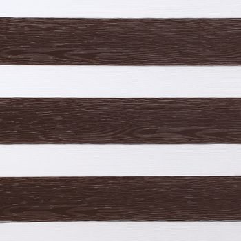 Daybreak brown which is a dark brown wood textured swatch that is striped with white 