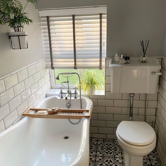 white wooden venetian blinds in white bathroom