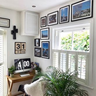 windows dressed with white cafe style shutters in a study