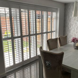 French doors dressed with shutters in living room