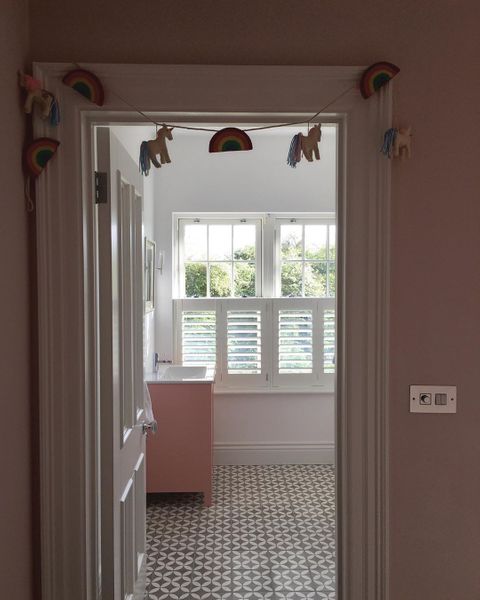 white cafe style shutters in kids bedroom