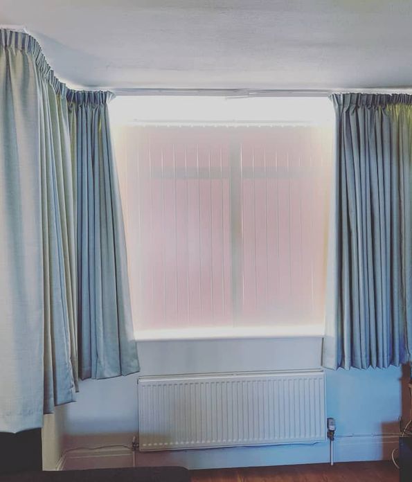 light blue curtains in a bedroom