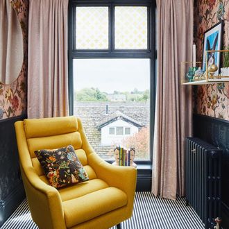  coral and white marble effect fabric curtains hanging on victorian, single glazed window