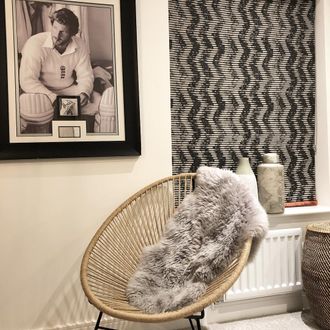 Fade-out black and white wavy line zig-zag printed roman  blind hanging in guest bedroom