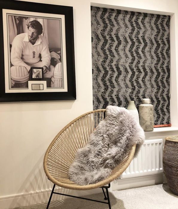 Fade-out black and white wavy line zig-zag printed roman  blind hanging in guest bedroom