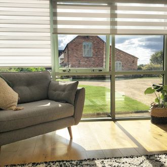 Enlight blinds hanging on the doors of barn house