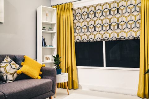 Metro Sauterne Roman blind with Tetbury Mustard curtains in living room